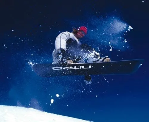 Lloyd snowboarding above Sainte Foy